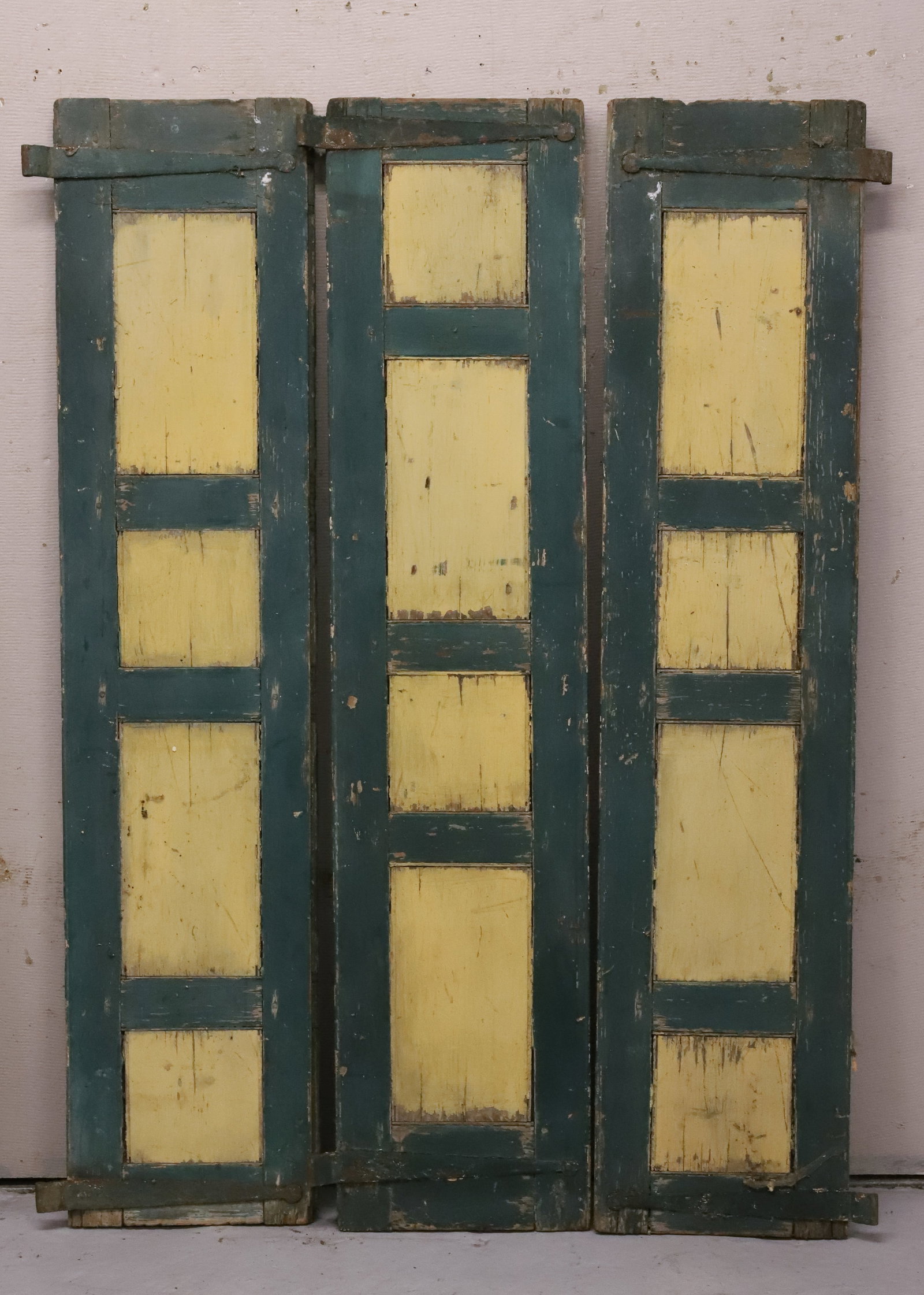 (3) MATCHING PAINTED SHUTTERS: GREEN / CREAM PANELS ON ONE SIDE. STRAP HINGES. 70" X 16". PLEASE READ CAREFULLY - ITEMS MUST BE PAID FOR THROUGH LIVE AUCTIONEERS OR WITH CASH OR CHECK IN PERSON - Terms for Purchasing and Shipping