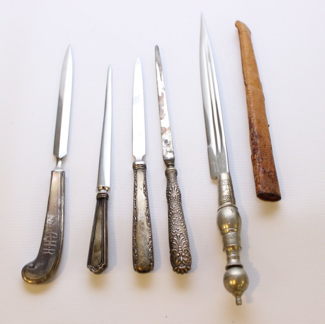 (5) SILVER HANDLE LETTER OPENERS: 4 STERLING HANDLES AND ONE NICKEL