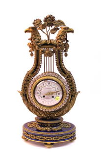 FRENCH MANTLE CLOCK: PAUL SORMANI PARIS CIRCA 1880 CLOCK WITH LYRE - FORM CLOCK CASE WITH PHOENIX BUSTS, SUSPENDING FLORAL GARLANDS - DIAL SIGNED SORMANI PARIS 22 3/4" X 10 1/4" X 5 1/2"