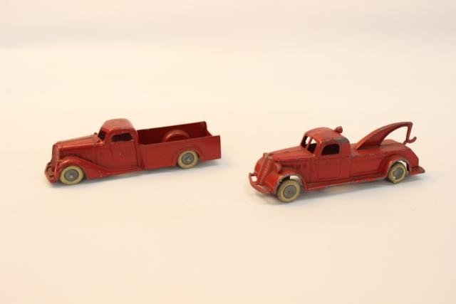 PAIR OF TOOTSIE TOYS: PAIR OF VINTAGE CAST IRON TOOTSIE TOY TRUCKS, ONE IS TOW TRUCK AND OTHER IS PICKUP, MINOR PAINT LOSS FROM USE, RUBBER WHEEL ON TOW TRUCK HAS DAMAGE, 5.5".