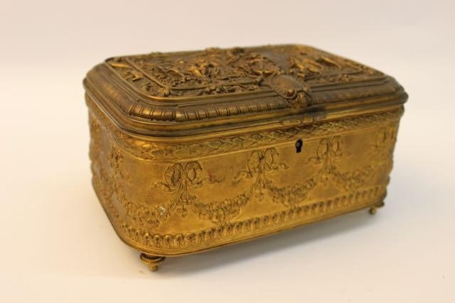 FRENCH DRESSER BOX: ANTIQUE FRENCH BRONZE DRESSER BOX WITH MUSICAL VILLAGE SCENE AND FLOWER VALLANCE MOTIF. 4" X 5" X 7.25"