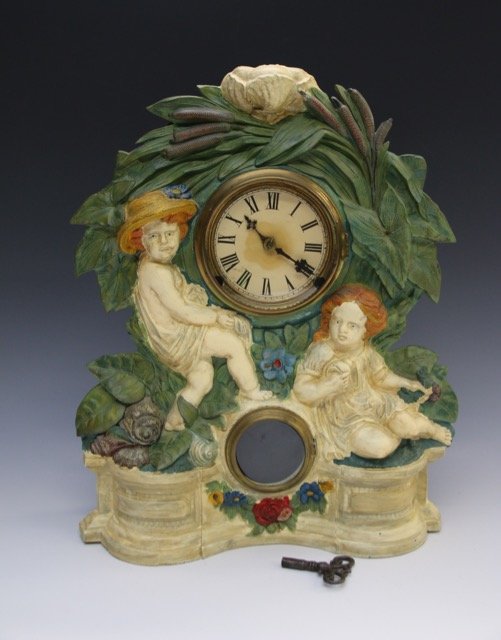 CAST IRON FIGURAL MANTLE CLOCK (1 of 4)