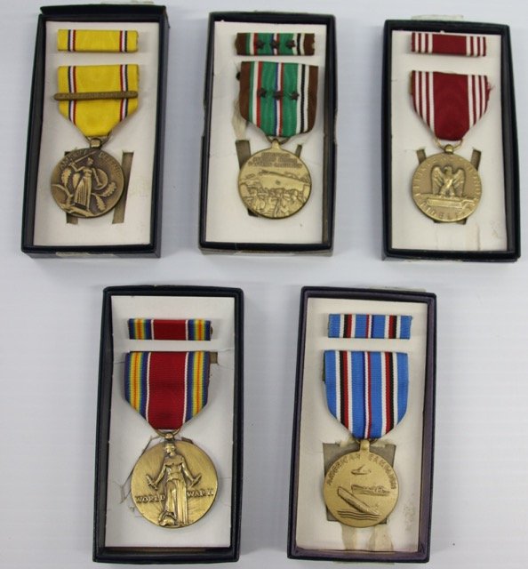 LOT OF MEDALS: AMERICAN CAMPAIGN MEDAL, WORLD WAR II MEDAL, AMERICAN DEFENSE MEDAL, EUROPEAN - AFRICAN MIDDLE EASTERN CAMPAIGN, AND EFFICIENCY HONOR AND FIDELITY MEDALS AND BAR PINS - IN ORIGINAL BOXES Dimensions: