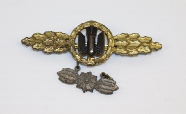 GOLD BOMBERS PILOT CLASP: WITH HANGER BY: M KUNSTSTOFF, GABLONZ Dimensions: 3"
