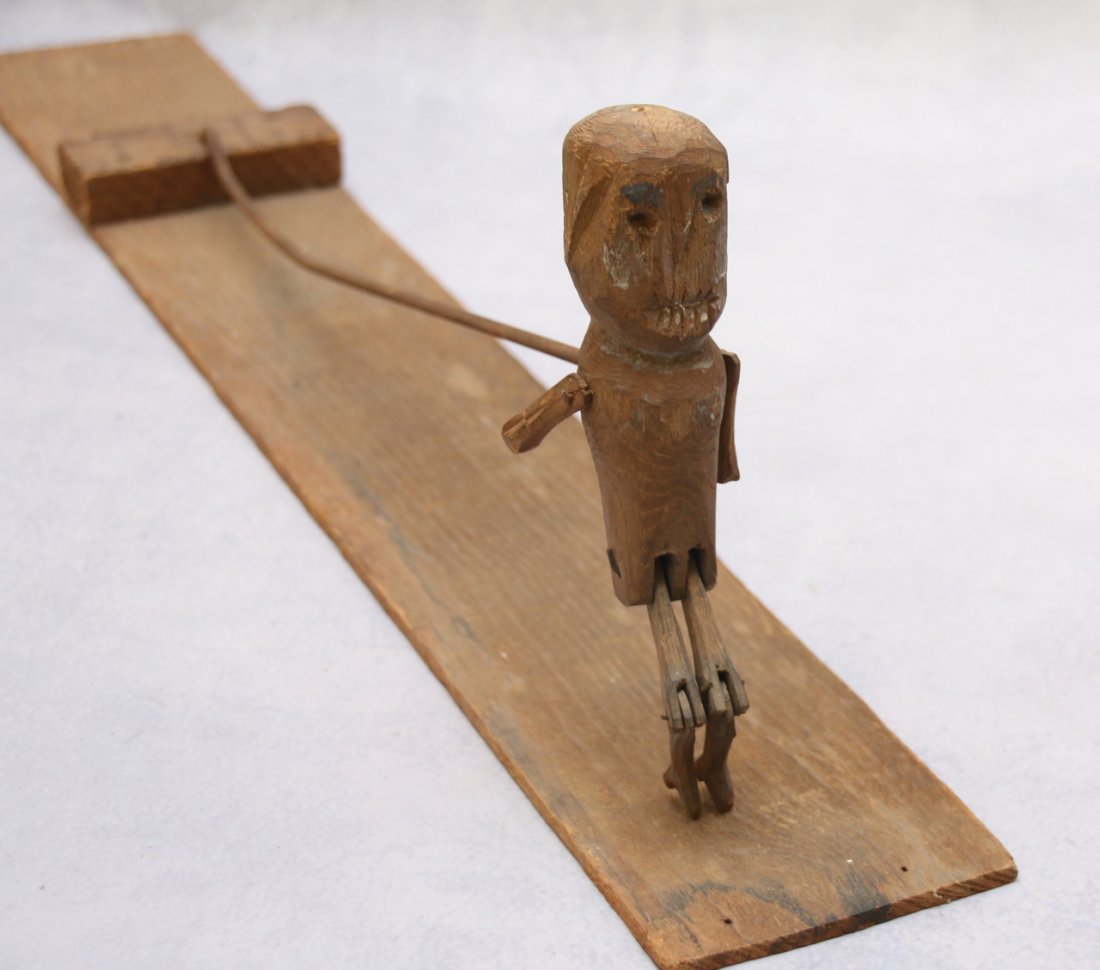 CONESTOGA WAGON JIGGER: CARVED WOODEN RETICULATED MAN 7 1/2" FIGURE - 26" BOARD