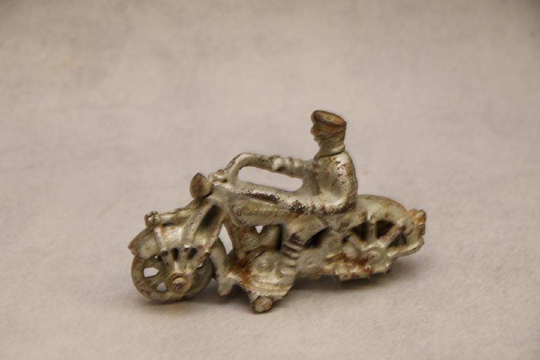 CAST IRON MOTORCYCLE: MARKED CHAMPION ON FUEL TANK - DIMENSIONS: 5"