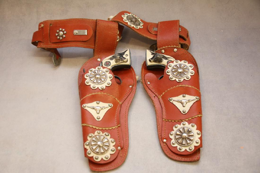 CHILDS GUN AND HOLSTER: PAIR OF CAP GUNS MARKED WESTERN