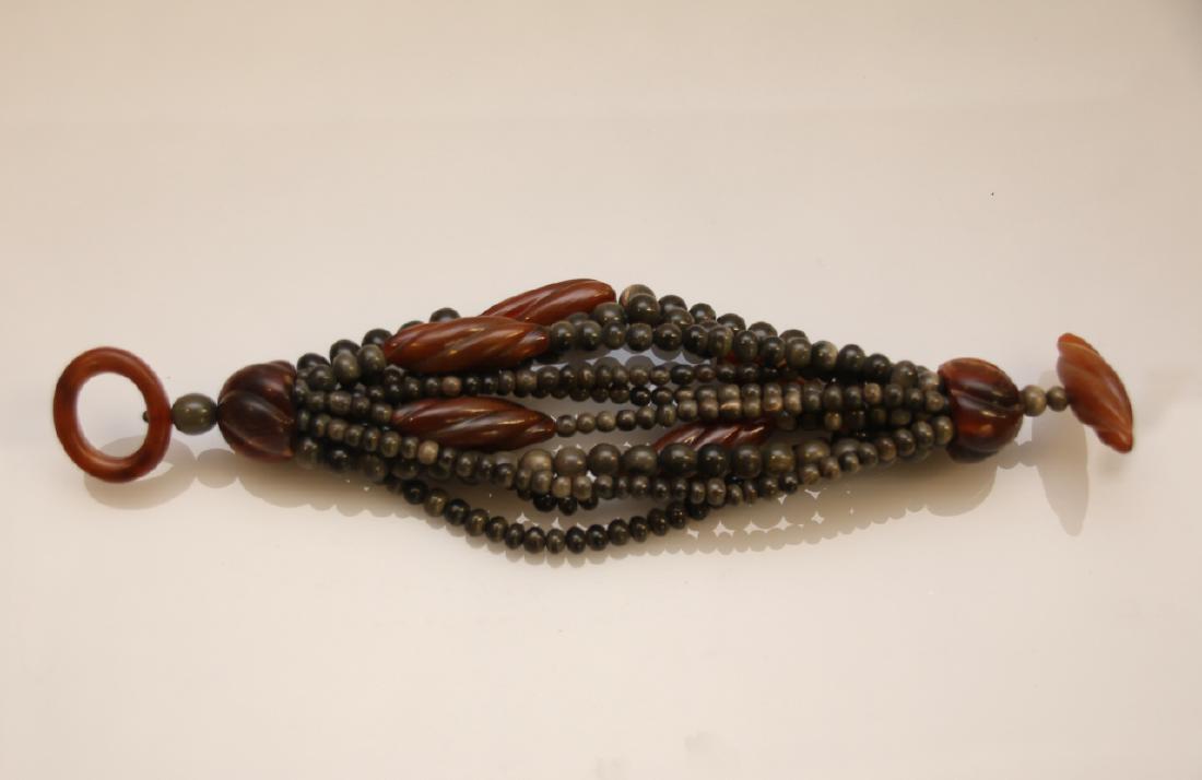 MONIES HORN AND WOOD BRACELET: MONIES HORN AND WOOD BRACELET DIMENSIONS: 10"