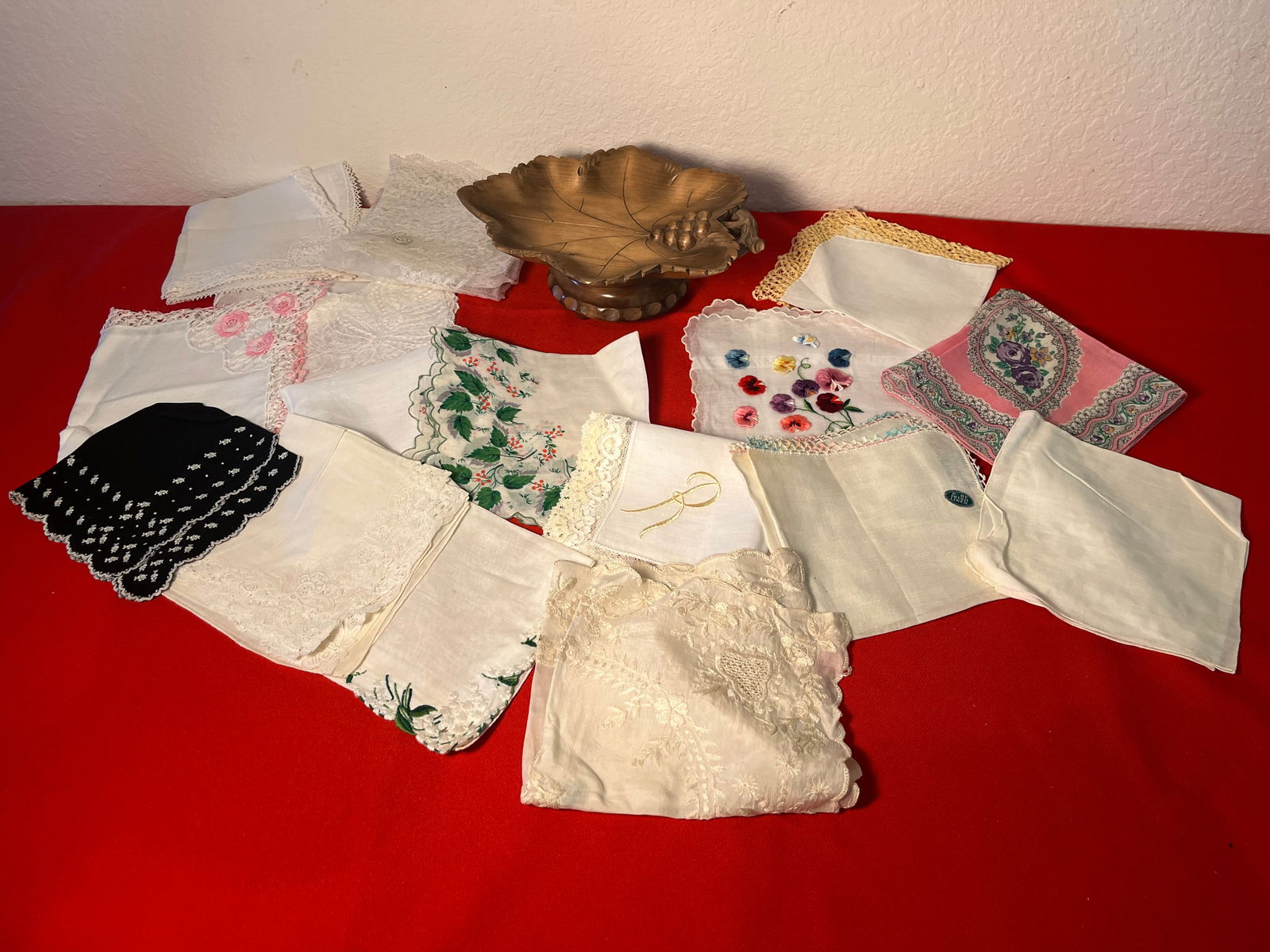 Wood Leaf Music Box and Lot of 19 Handkerchiefs: Music box works well. Plays "Spring has returned to the mountains". No damages. 19 handkercheifswith a few stains. 1 has hold in the corner.