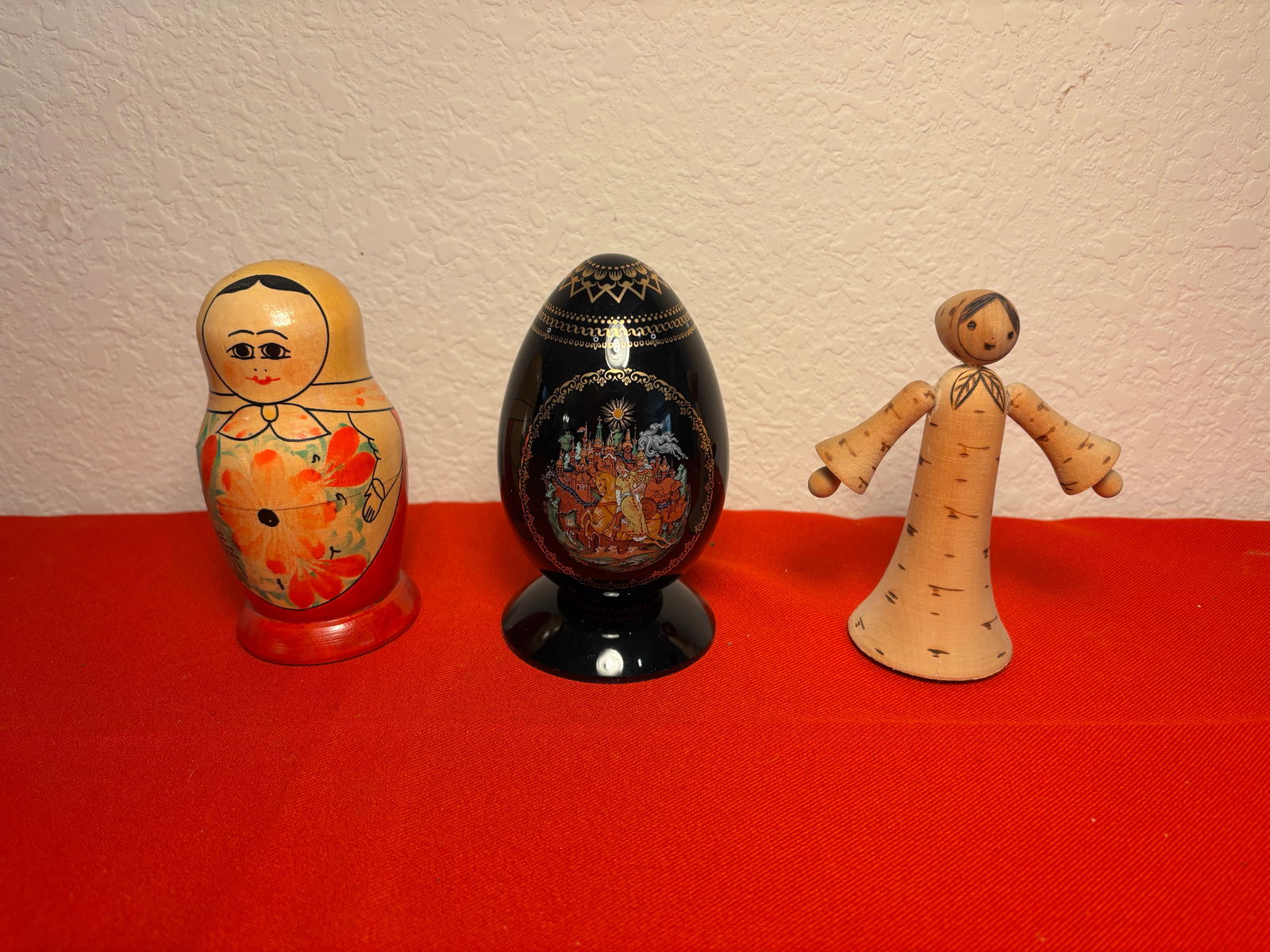 Set of 3 Russian Vintage Collectables: Handmade wood doll and nesting dolls. Decorative Porcelain Egg. Good condition. Complete Nestingdoll set. All pieces are signed. Dimensions are for Decorative Egg