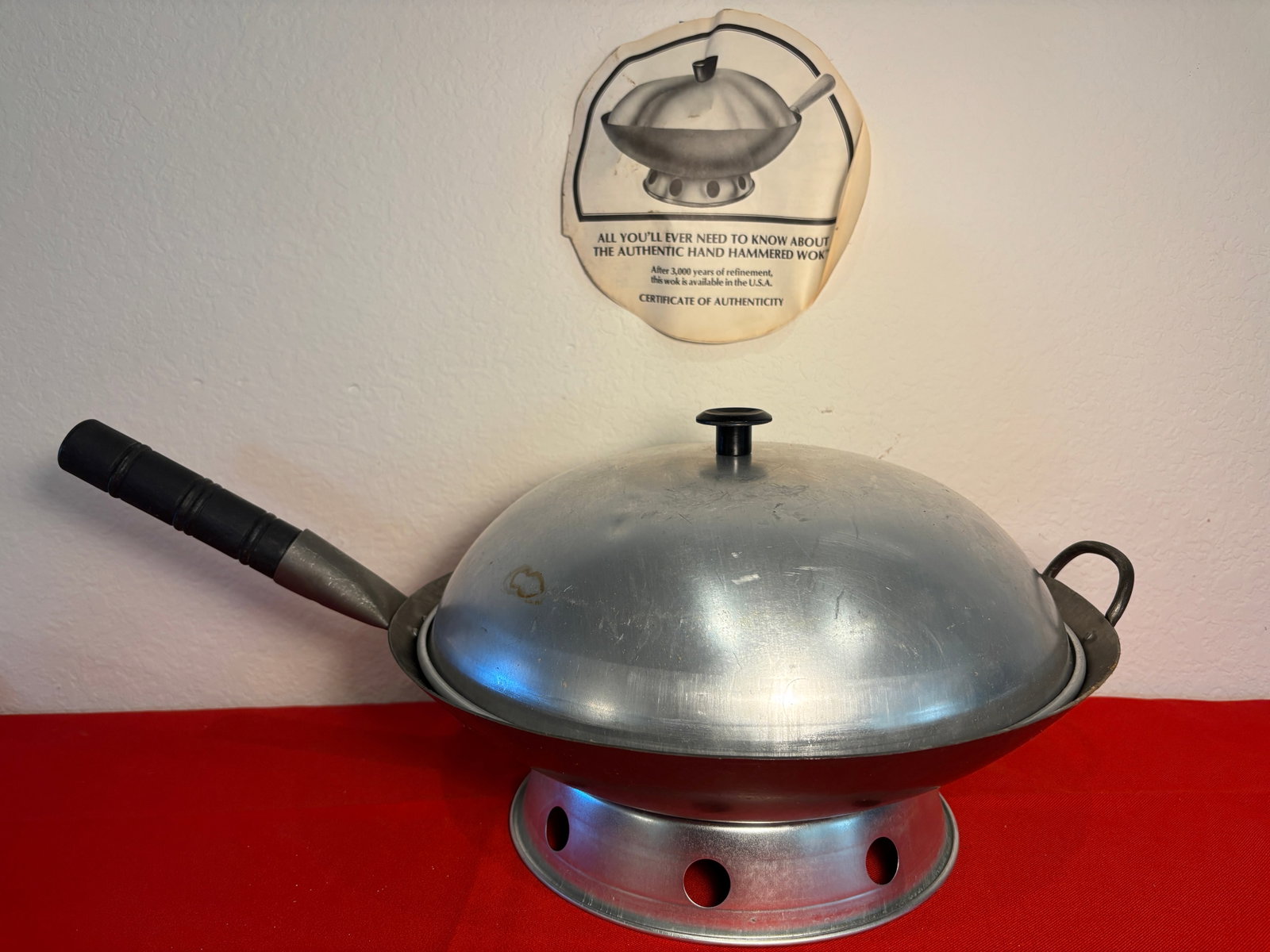 Hand Hammered Wok, 4 Pieces: Wok, Fire Ring, Lid, and Handle. Great Wok of China. Has certificate of Authenticity. Minor staining.Used condition. Dimensions are for largest piece.