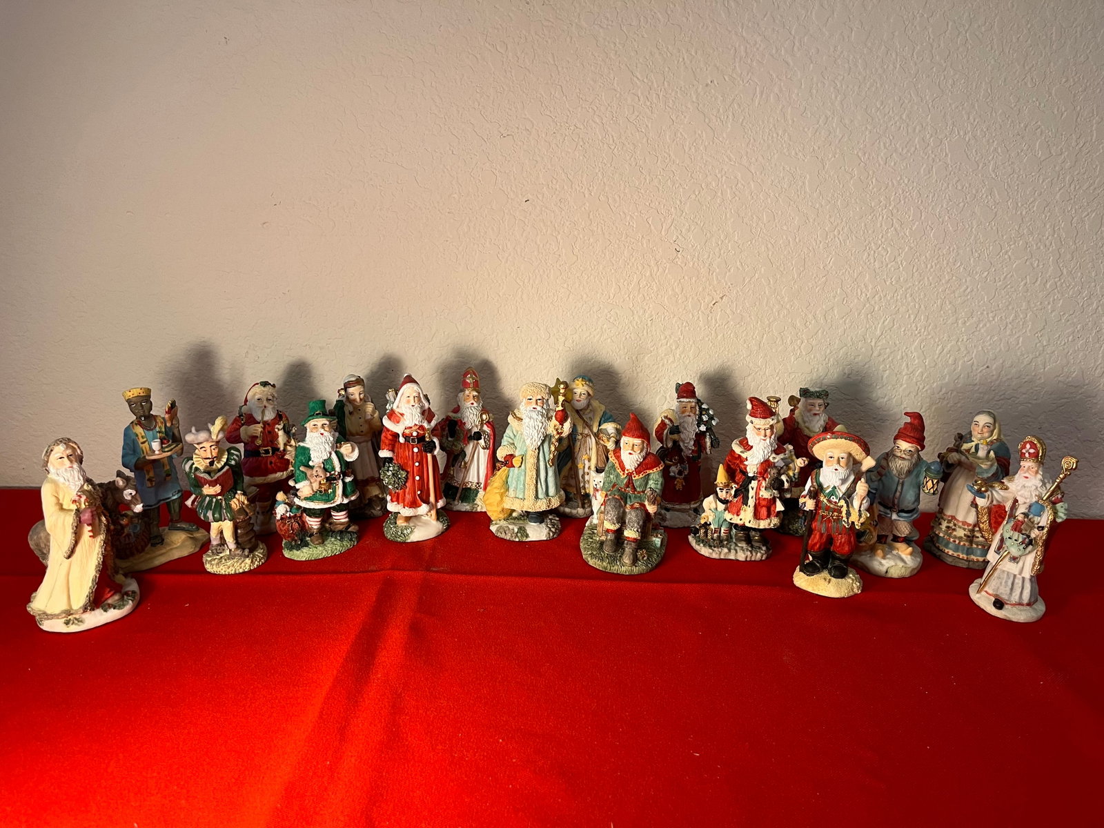18 Santa's Around the World Lot: Santa's from all over the world. Made of resin. 1993. All have identifying labels on bottom. No damages