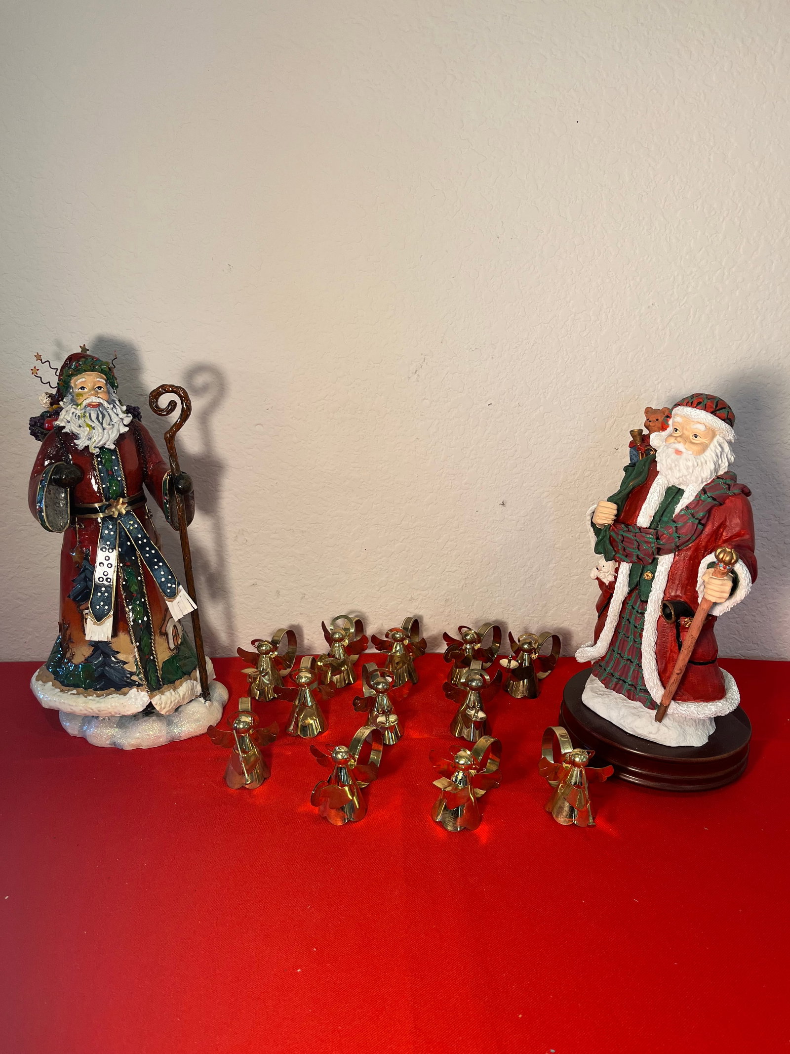 Angel Napkin Holder & Santa Lot, 14 Pieces: Gold Tone Angel Napkin Holders. Set of 12. Slight tarnish. No damages. 1 Musical Santa. No damages.Metal Santa. Has 2 holes in back.