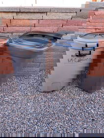 2 Rubbermaid Plastic Trash Cans