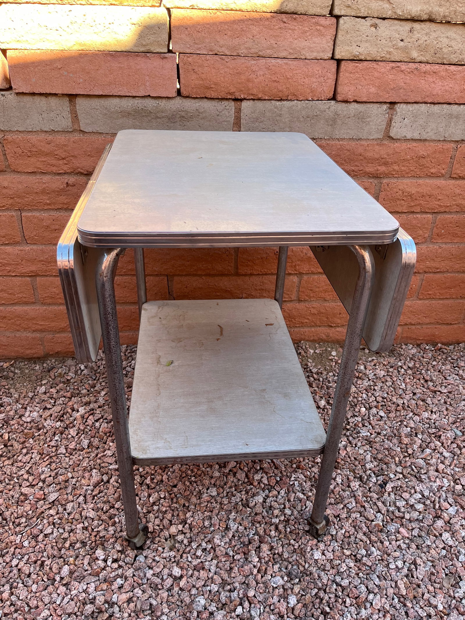 Vintage Wood and Metal table on wheels: Collapsable Sides. Used. 33:" Wide Folded Open