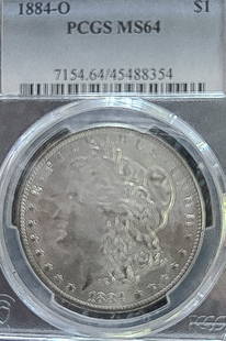 1884-O Morgan Silver Dollar MS64: This 1884-O Morgan Dollar has been graded MS-64 and is guaranteed by PCGS. This iconic design comes secured in PCGS encapsulation which ensures the coin's condition is protected and verified.Morgan