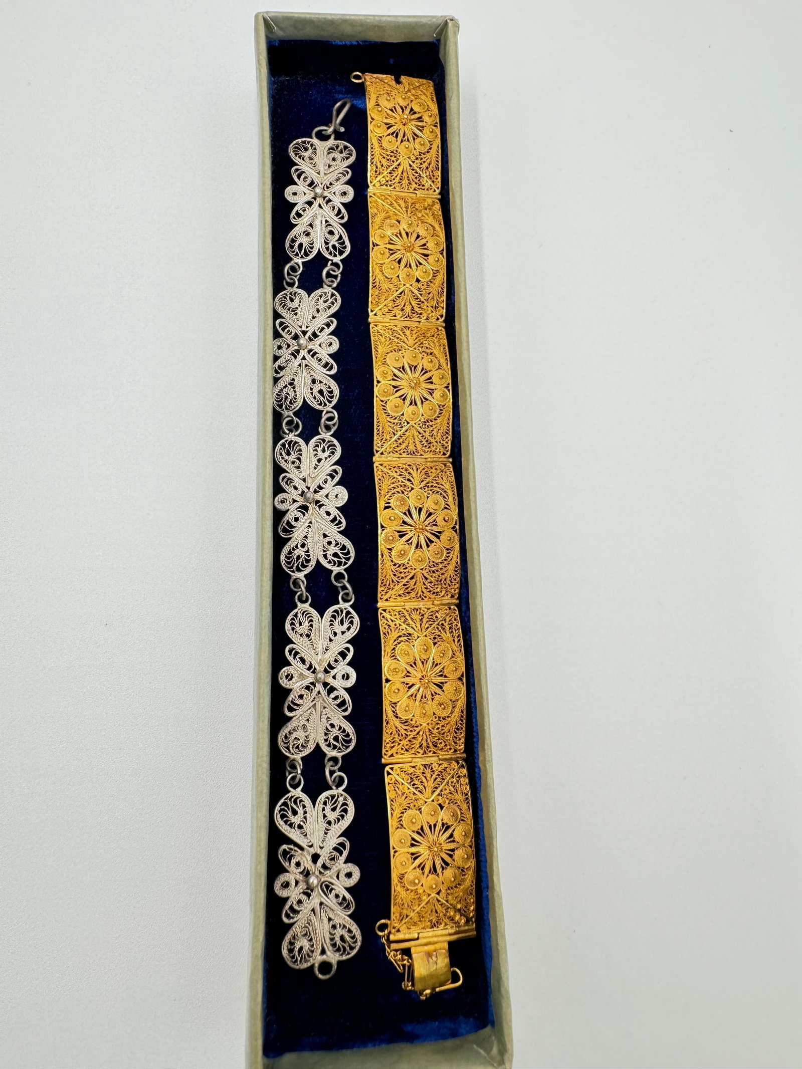 Two spectacular vintage filigree bracelets: One is gold tone and other one is silver tone. Costume jewelry. Both are measuring 7” long. Good vintage condition. See pictures for more details as they are the best description. WE PROVIDE IN-