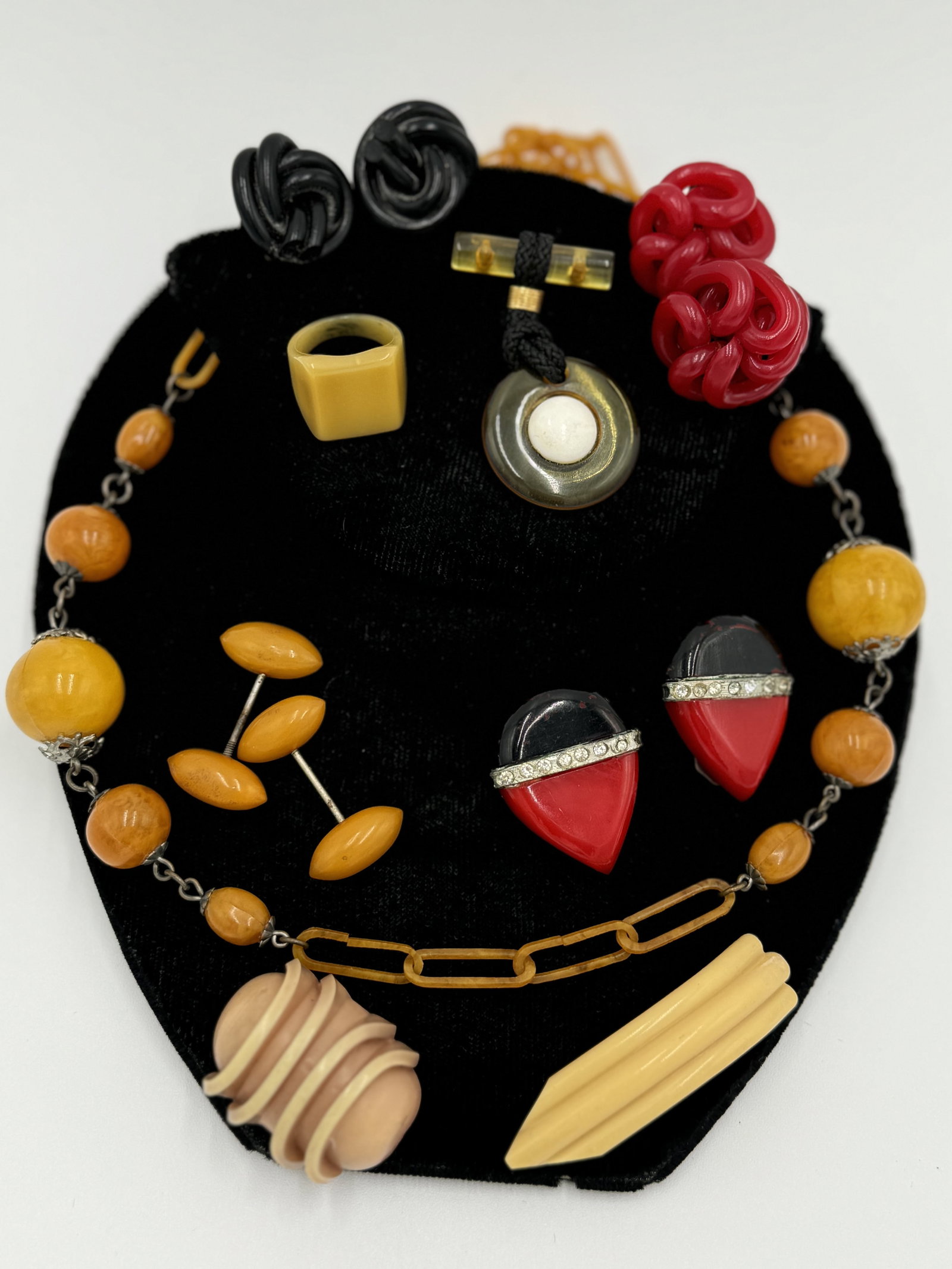 Nice collection of vintage plastic jewelry: Including necklace, brooch, fur/dress clips, screw back earrings, ring, button and more. Good vintage condition. See pictures for more details as they are the best description. WE OFFER IN-HOUSE/COMBI
