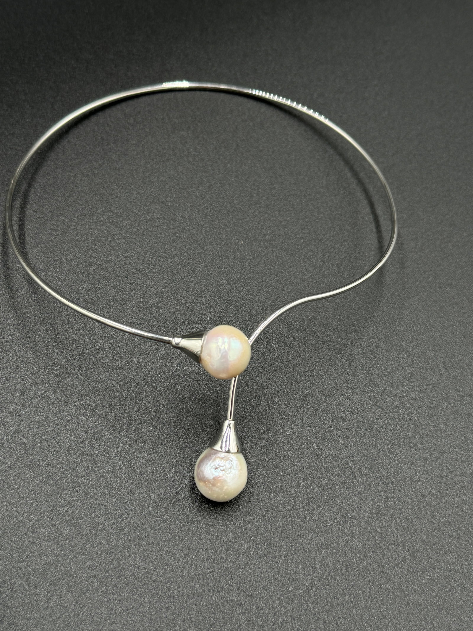 Sterling silver Double Baroque Pearl Choker: Double Baroque Pearl Choker features sizable baroque pearls in creamy white color. Moreover, sterling silver 925 wrapping the pearl on both sides makes the choker fashionable.. Beautiful and unique. 1
