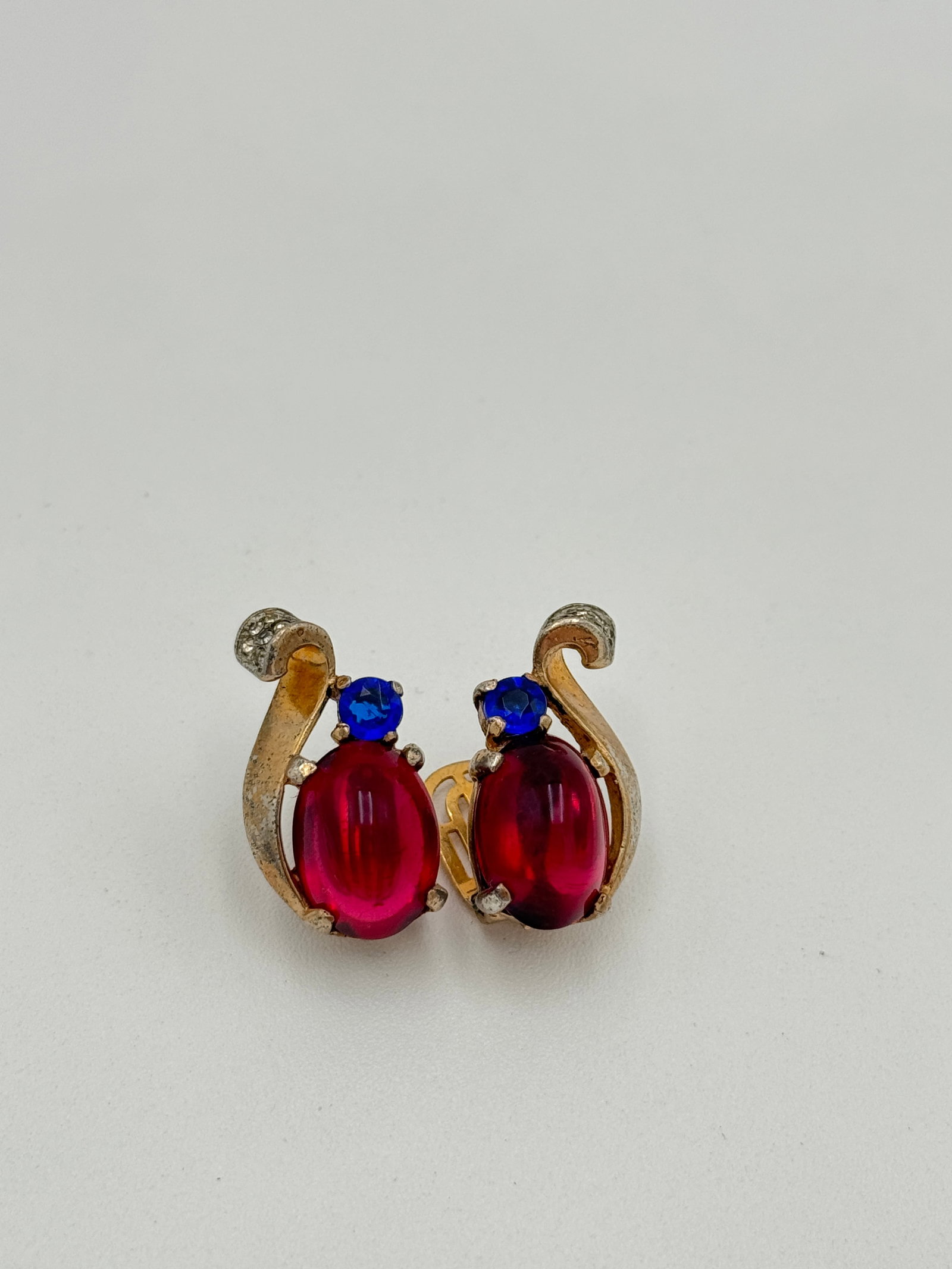 Amazing Trifari 1945 Sterling Silver with Red Cabs Earrings, Alfred Phillipe: Amazing Trifari 1945 Sterling Silver with Red Cabs Earrings, Alfred Phillipe. Trifari sterling silver with large red cabochon glass stone swirl earrings with blue stone and rhinestone accent. Designed