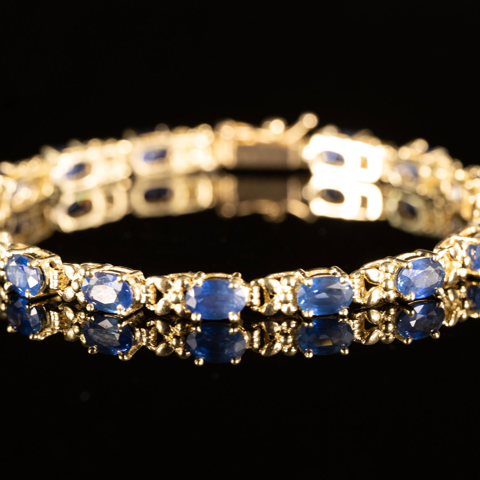 10ctw Blue Sapphire Oval Gemstone Tennis Bracelet in 14k Yellow Gold: Metal Type: 14K Yellow Gold (Tested) Weight: 10.3G Gold Melt Value: $507