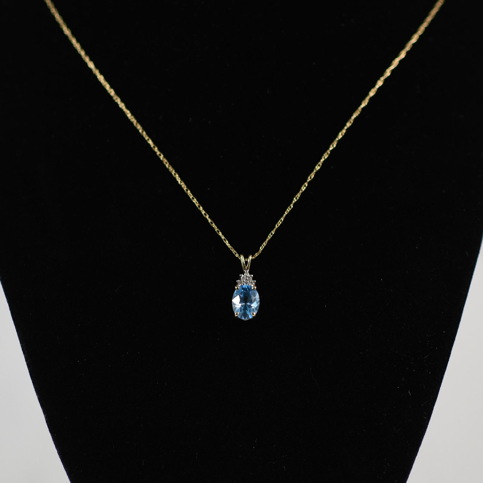 Blue Topaz Oval and Diamond Pendant on Chain in 14K Yellow Gold: Metal Type: 14K Yellow Gold(Tested) Weight: 2.3G Gold Melt Value: $120