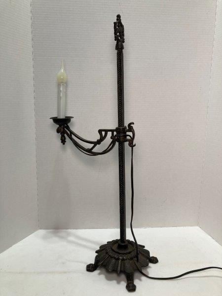 Iron Bridge Lamp: Wired. Faux candle and candelabra bulb. Measures 25"T x 10 1/2"W x 8"D. In good condition with age-appropriate wear. Shipping Available.