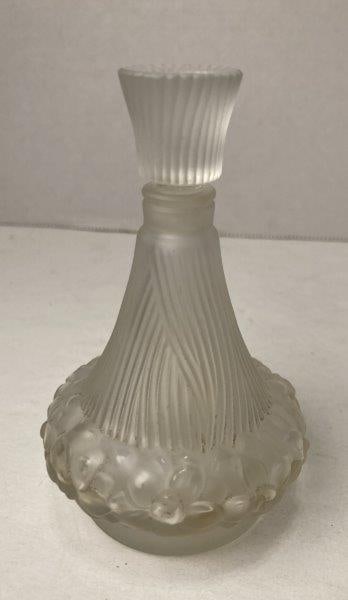 Molded Commercial Perfume Bottle: Genie shaped, frosted glass bottle with ground stopper. Made in France. Measures 4"T. In good condition and with normal wear. Please refer to photos. Shipping Available.