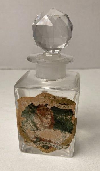 Houbigant Commercial Perfume Bottle: Quelques Fleurs fragrance. Vintage bottle. Measures 5 1/2"T. With wear and staining to label. Please refer to photos. Shipping Available.