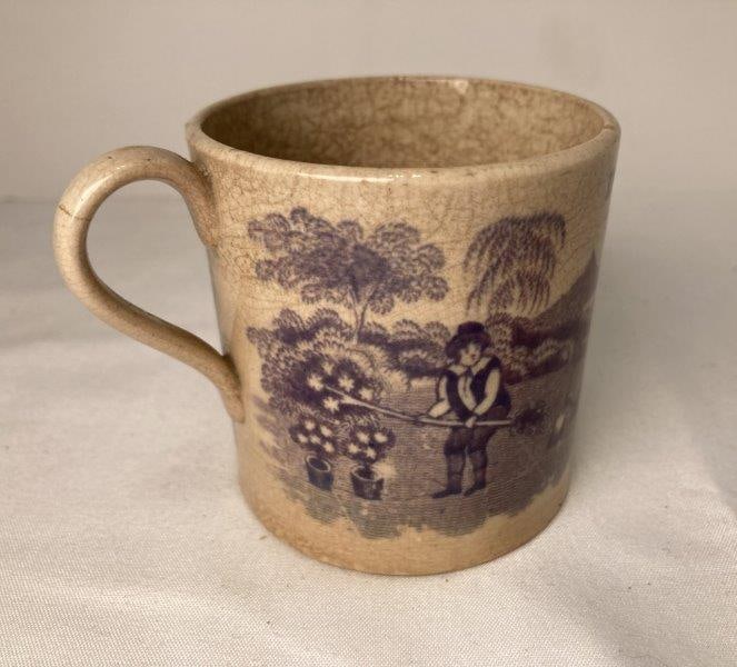 Childs Mug With Aubergine Transfer Of Dr. Franklin's Maxims: Aubergine transfer depicting poem as well as gardeners. Measures 2 5/8"T. With hairline crack at top of handle and crazing throughout. Some discoloration present. Please refer to photos. Shipping Avai