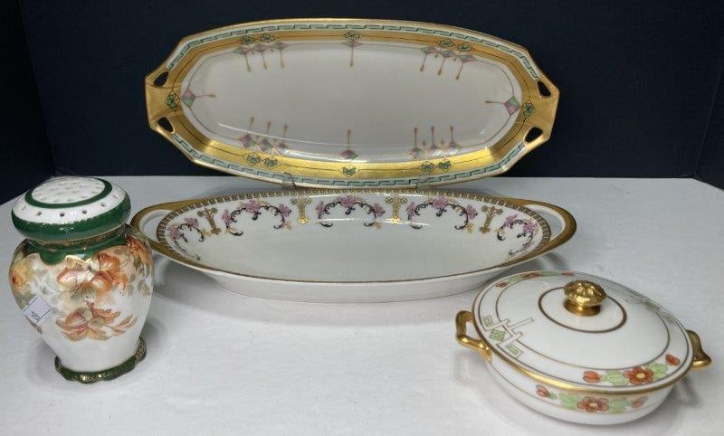 Four Pieces Pickard and Other China: Includes Pickard celery dish, Pickard covered dish, Austrian muffineer, and Limoges celery dish. Various sizes. In good condition. Shipping Available.