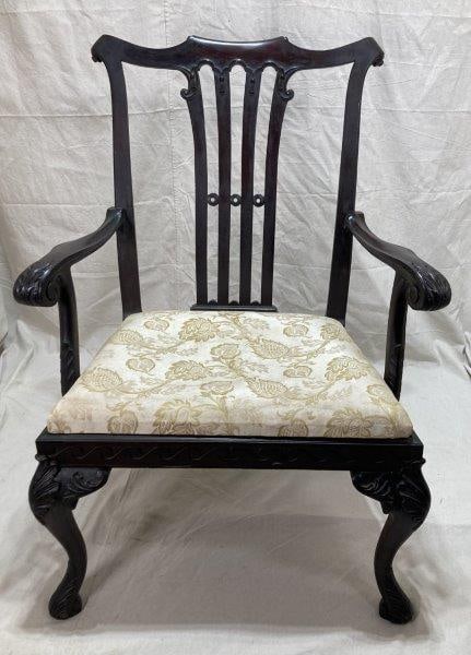 Antique Oversized Carved Chippendale Chair: This exceptional oversized Chippendale chair exhibits masterful hand-carved craftsmanship, featuring a shaped splat with carved ears and an elegantly carved crest at the top. The shaped arms are suppo