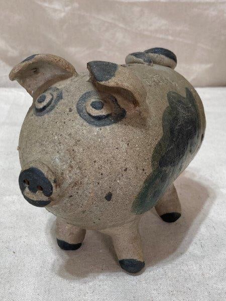 Stoneware Piggy Bank: Inscribed Thetis, has coins inside. Measures 6''T x 4''W x 6 1/2''D. Shipping Available.