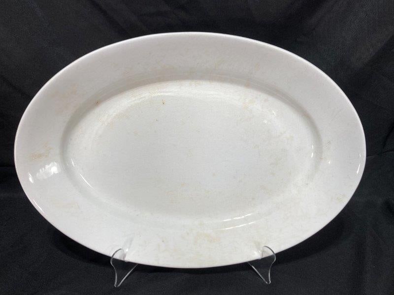 Powell and Bishop Ironstone Platter: Makers mark on bottom. Measures 14''T x 19"W. In good condition with age appropriate discoloration and crazing. Shipping Available.