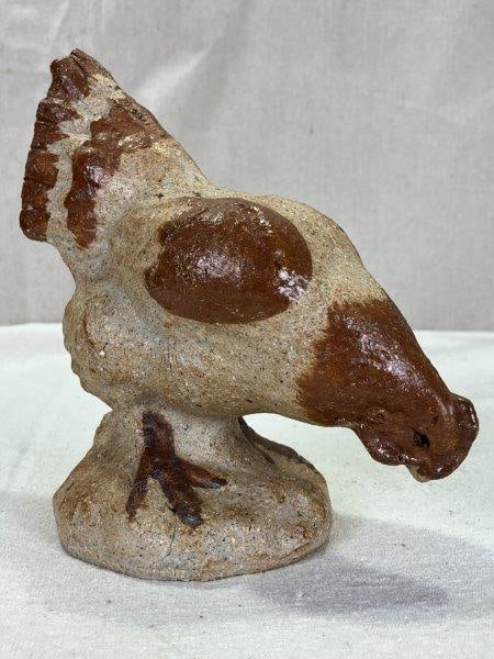 Stoneware Chicken, 20th Century: This charming stoneware chicken features a warm tan and brown glaze with appealing surface variation. Measuring approximately 7" tall by 7" wide, it is in good condition with a minor firing crack typi
