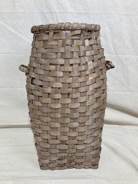 Large Floor Basket: Generously sized and finely woven, this large floor basket features a strong form and warm, natural patina. Measures 27''T x 13''W. Good condition with some loss to handles and bottom. Shipping Availa