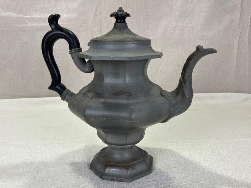 19th Century Pewter Teapot: This elegant pewter teapot features a classic 19th-century form and bears a makerâ€™s mark on the base. Measuring approximately 9 1/2" tall by 10 1/2" wide. Good condition. Shipping A