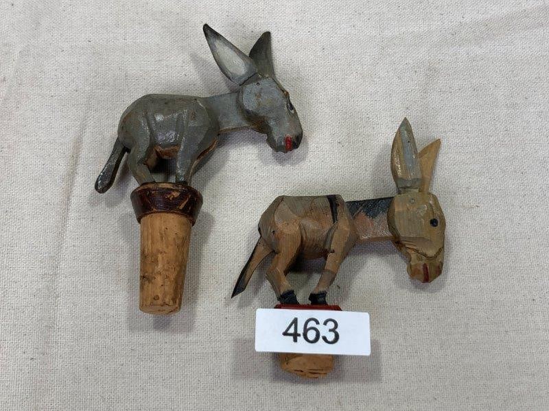 Pair of Figural Folk Art Wine Stoppers: Whimsical and full of personality, this pair of folk art wine stoppers features hand-painted donkey figures with movable heads. Largest measures approx. 5''T. One stopper has loss to the cork. Shippin