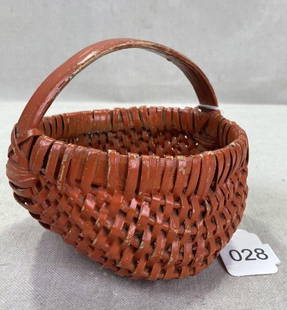 Small Painted Buttocks Basket: Charming small buttocks basket featuring a reddish painted finish and classic arched handle. Measures approx. 4 1/4''H x 5''W. Some loss to the paint. Shipping available. 