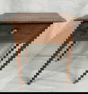 Southern One-Drawer Stand: Charming Southern one-drawer stand featuring a two-board top and gracefully tapered legs. Crafted from yellow pine with warm patina and simple, functional design typical of early Southern furniture.