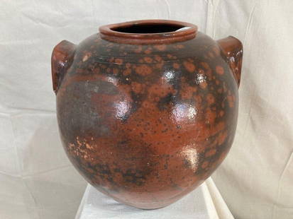 Rare 19th Century Redware Jar: Exceptional redware jar featuring incised ring decoration below the rim and two applied lug handles. Subtle surface decoration enhances its rich, timeworn glaze, with a makerâ€™s