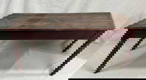 Primitive Yellow Pine Table: Three-board top table with turned legs and a warm reddish finish. Displays a well-worn patina with surface wear consistent with age and use. Sturdy and full of rustic charm. Measures approximately 31