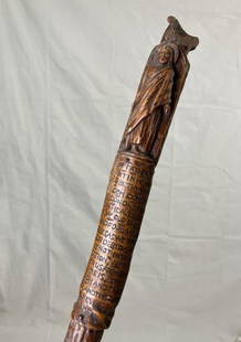 Religious Folk Art Cane with Carved Figure of Jesus: A spiritually expressive folk art cane featuring a carved figure of Jesus just below the handle, with the Lordâ€™s Prayer inscribed along the shaft beneath his feet. Finely detailed
