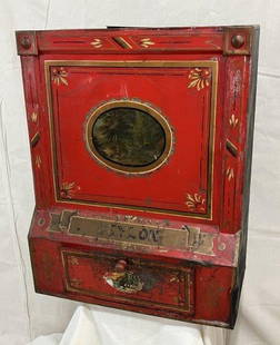 General Store Painted Tea Tin: Striking general store tea tin featuring bold red and gold paint with a central painted medallion. Measures approx. 24''H x 19''W x 10 1/4''D. Some paint loss and a dent on the right front side.