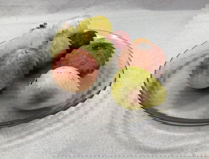 Alabaster Carved Stone Fruit in Glass Bowl: Charming collection of eight carved alabaster stone fruitsâ€”including apples, a peach, a pear, and othersâ€”displayed in a clear glass bowl. Each piece showcases