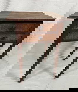 19th Century Cherry Two Drawer Stand: Crafted in cherry with striking bird's-eye maple drawer fronts, this elegant 19th-century stand features dovetailed construction and finely turned legs. Measures 28 7/8 inches tall by 21 3/4 inches