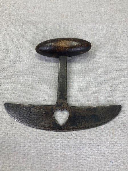 Folk Art Food Chopper: Charming folk art food chopper featuring a shaped wood handle with a heart cutout at the center and inlaid initials. Exhibits a wonderful aged patina. Measures approx. 6''H x 6 3/4''W. Shipping availa
