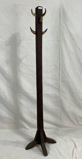 Steer Horn Hat Rack: Tall and striking hat rack featuring five mounted steer horns arranged on a central post with a nicely aged surface. Stands on a square base. Measures approximately 72''H x 15'' square at the base.