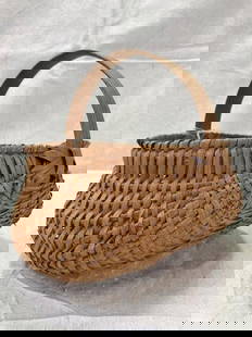 Split Oak Buttocks Egg Basket: Traditional form with natural finish and arched handle, finely woven in split oak. Measures approximately 7''H x 8''W x 7 1/4''D. Good condition with minor wear. Shipping available. 