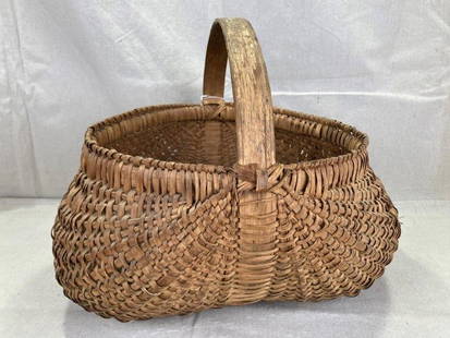 Large Splint Oak Buttocks Gathering Basket: Generously sized buttocks-style gathering basket crafted from splint oak, showcasing natural tones and classic form. Measures approx. 14''H x 15''W x 18''D. Some wear to the bottom consistent with